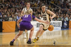 ALBANY, NEW YORK – APRIL 1:  Iowa guard CAITLIN CLARK (22) drives past LSU defender HAILEY VAN LITH (11) with an around the back dribble during the 2024 NCAA Women’s Basketball Tournament Albany 2 Regional Final at MVP Arena on April 1, 2024, in Albany, N.Y.  (Scotty Rausenberger/A Lot of Sports Talk)