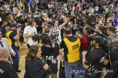 ALBANY, NEW YORK – APRIL 1: Iowa’s CAITLIN CLARK waves to the crowd amongst a sea of reporters after the 2024 NCAA Women’s Basketball Tournament Albany 2 Regional Final at MVP Arena on April 1, 2024, in Albany, N.Y.  (Scotty Rausenberger/A Lot of Sports Talk)