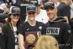 ALBANY, NEW YORK – APRIL 1:  Iowa’s CAITLIN CLARK (22) poses for a photo with her parents ANNE NIZZI CLARK and BRENT CLARK after the 2024 NCAA Women’s Basketball Tournament Albany 2 Regional Final at MVP Arena on April 1, 2024, in Albany, N.Y.  (Scotty Rausenberger/A Lot of Sports Talk)