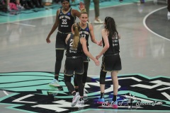 BROOKLYN , NEW YORK— SEPTEMBER 22:  New York Liberty guard Sabrina Ionescu (20), forward Leonie Fiebich (13) and forward Breanna Stewart (30)  celebrate the lead during the playoff game between New York Liberty and Atlanta Dream at the Barclays Center on September 22, 2024, in Brooklyn, N.Y. (Scotty Rausenberger/A Lot of Sports Talk)